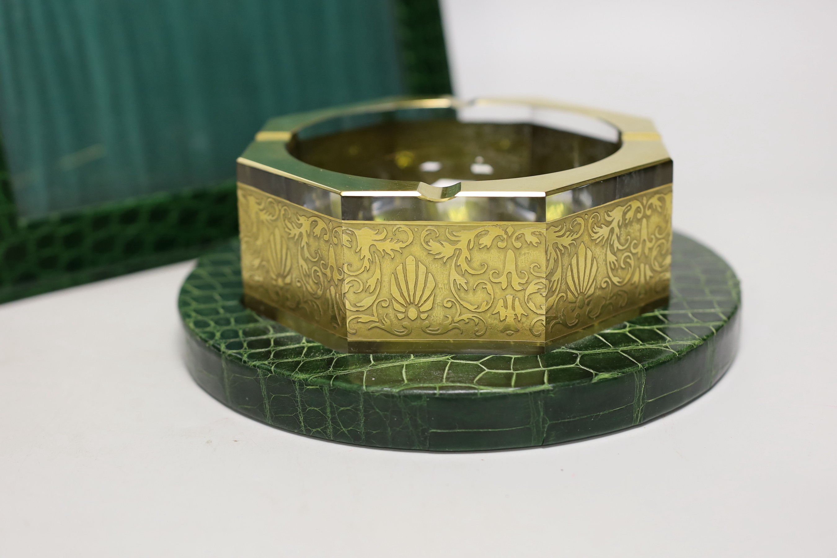 An Asprey green faux crocodile hide desk set, comprising photograph frame, 32 cm high and Moser glass ashtray